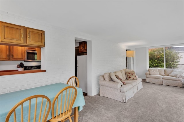5352 Highgrove Rd, Whitehall, PA 15236 - living area featuring light colored carpet and brick wall