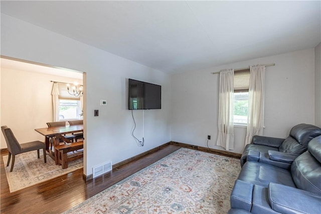 1248 Hyde Park Rd, Allegheny Twp Wml, PA 15656 - living area with a chandelier, dark wood-style flooring, and baseboards