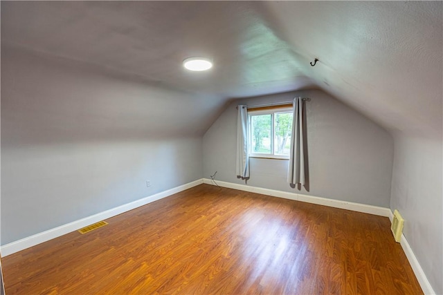 1248 Hyde Park Rd, Allegheny Twp Wml, PA 15656 - bonus room with baseboards, wood finished floors, and vaulted ceiling