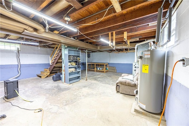 1248 Hyde Park Rd, Allegheny Twp Wml, PA 15656 - basement featuring gas water heater, stairway, and concrete block wall