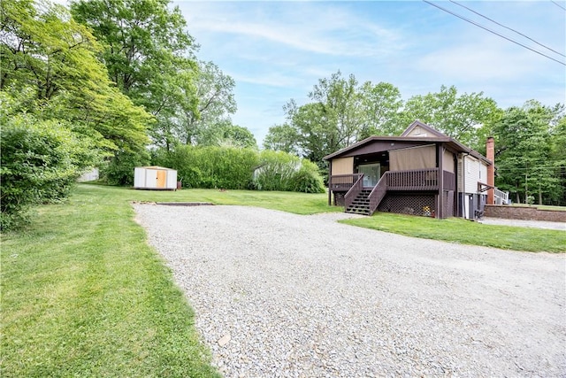 1248 Hyde Park Rd, Allegheny Twp Wml, PA 15656 - view of grassy yard with gravel driveway, stairs, and a deck