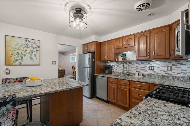 1426 Raven Dr, Pittsburgh, PA 15243 - kitchen with appliances with stainless steel finishes, a sink, decorative backsplash, and light stone countertops