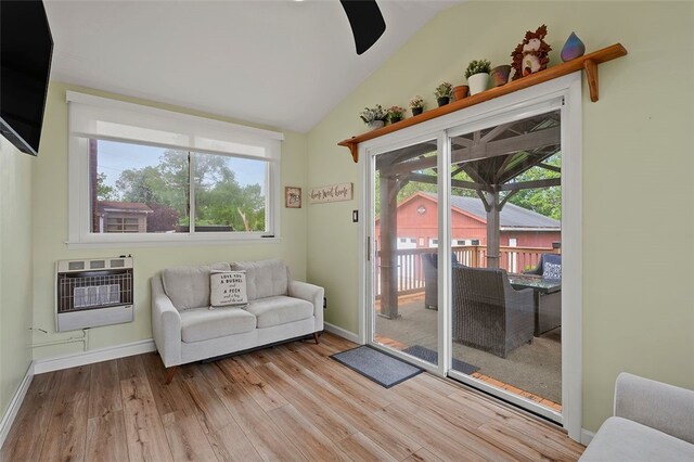 1426 Raven Dr, Pittsburgh, PA 15243 - living room with heating unit, wood finished floors, lofted ceiling, and baseboards
