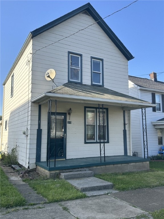 213 Indiana Ave, Avonmore, PA 15618 - view of front of home featuring covered porch and a shingled roof
