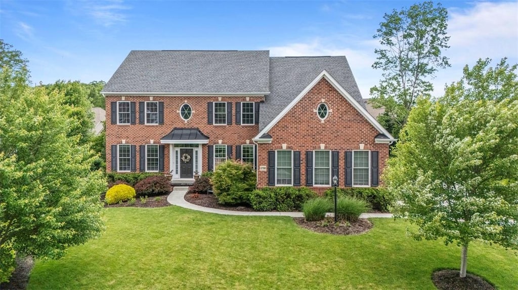 2790 Blackstone Dr, Hampton, PA 15044 - georgian-style home with brick siding and a front yard