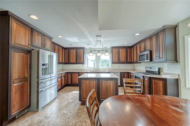 3318 Carriage Cir, Murrysville, PA 15632 - kitchen featuring stainless steel appliances, a sink, light countertops, a center island, and recessed lighting