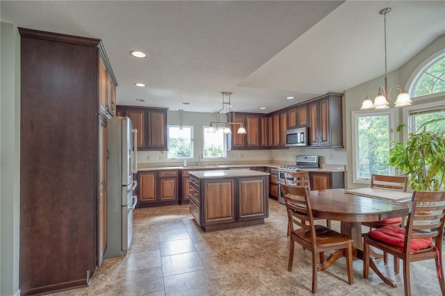 3318 Carriage Cir, Murrysville, PA 15632 - kitchen featuring appliances with stainless steel finishes, light countertops, a chandelier, a sink, and recessed lighting
