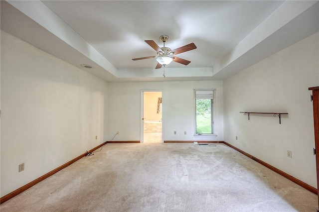 3318 Carriage Cir, Murrysville, PA 15632 - empty room with a raised ceiling, baseboards, ceiling fan, and carpet flooring