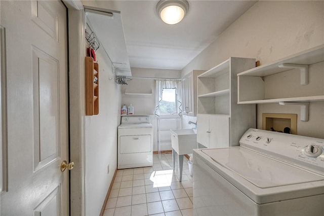 3318 Carriage Cir, Murrysville, PA 15632 - laundry area featuring separate washer and dryer, light tile patterned floors, and baseboards