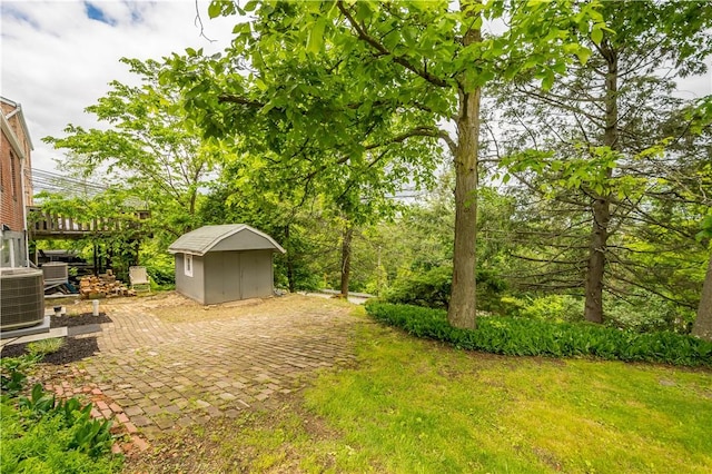 3105 Schieck St, Baldwin Boro, PA 15227 - view of grassy yard featuring a storage shed and a patio