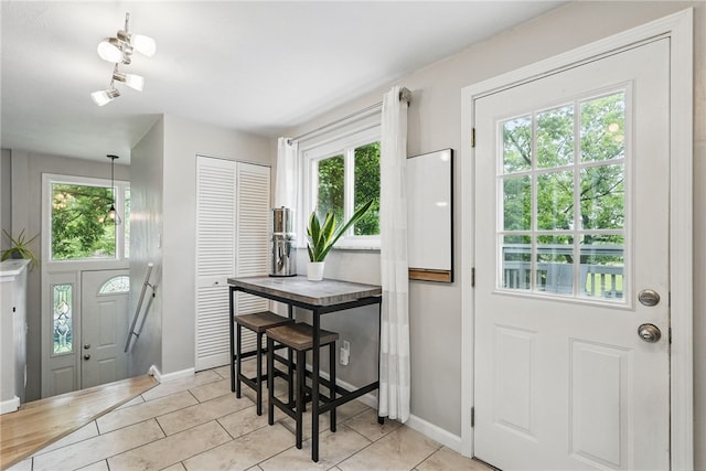 244 Burch Dr, Coraopolis, PA 15108 - entrance foyer with healthy amount of natural light, baseboards, and light tile patterned floors