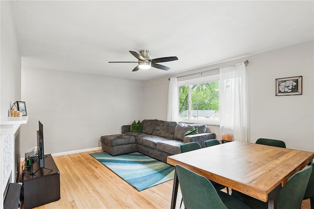 244 Burch Dr, Coraopolis, PA 15108 - living room featuring ceiling fan, wood finished floors, and baseboards
