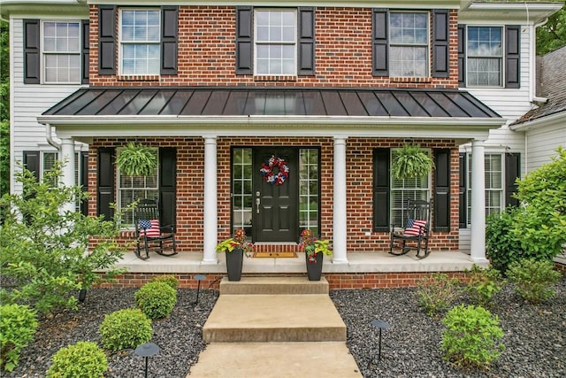 2104 Pierce Bluffs Dr, Hermitage, PA 16148 - entrance to property with covered porch, a standing seam roof, and brick siding