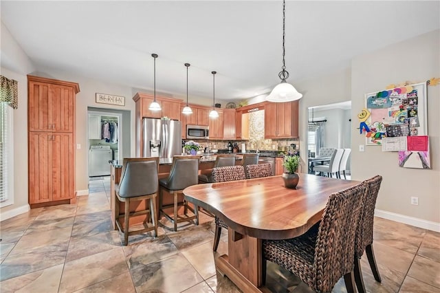 2104 Pierce Bluffs Dr, Hermitage, PA 16148 - dining space with washer / clothes dryer and baseboards