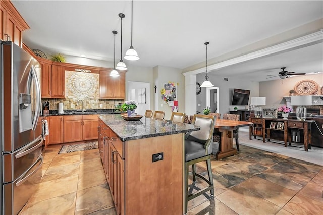 2104 Pierce Bluffs Dr, Hermitage, PA 16148 - kitchen featuring stainless steel fridge, a kitchen breakfast bar, a sink, decorative backsplash, and a center island