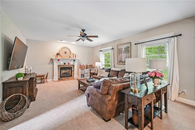 2104 Pierce Bluffs Dr, Hermitage, PA 16148 - living room featuring light carpet, a ceiling fan, baseboards, and healthy amount of natural light