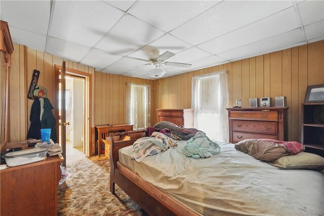 310 Main St, Belle Vernon Fay, PA 15012 - bedroom featuring wooden walls, carpet floors, a drop ceiling, and a ceiling fan
