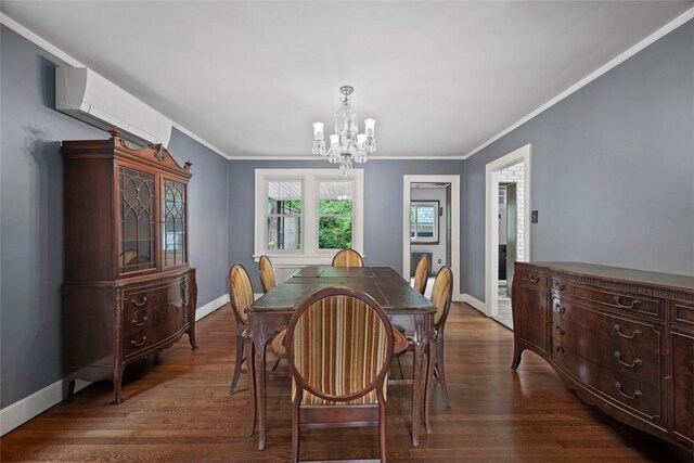 446 S Dallas Ave, Point Breeze, PA 15208 - dining room featuring a chandelier, ornamental molding, a wall mounted AC, dark wood-style flooring, and baseboards