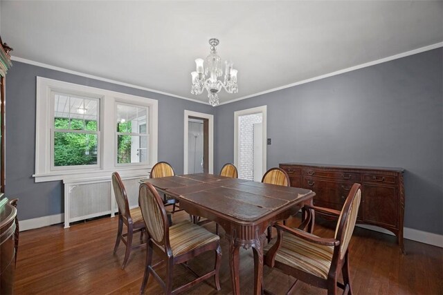 446 S Dallas Ave, Point Breeze, PA 15208 - dining room featuring a chandelier, baseboards, wood finished floors, ornamental molding, and radiator heating unit