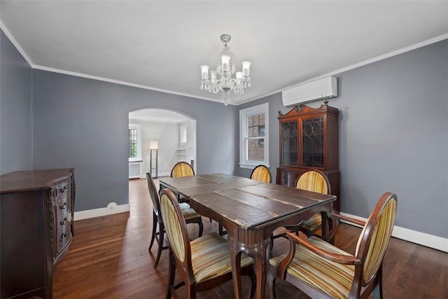 446 S Dallas Ave, Point Breeze, PA 15208 - dining space featuring arched walkways, a wall unit AC, baseboards, a chandelier, and crown molding