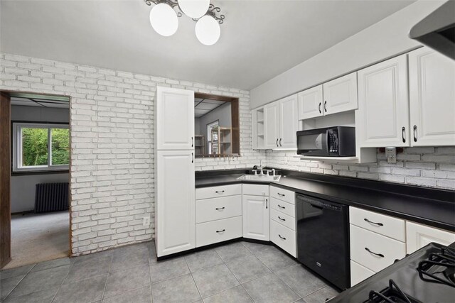 446 S Dallas Ave, Point Breeze, PA 15208 - kitchen featuring black appliances, dark countertops, a sink, radiator heating unit, and white cabinetry