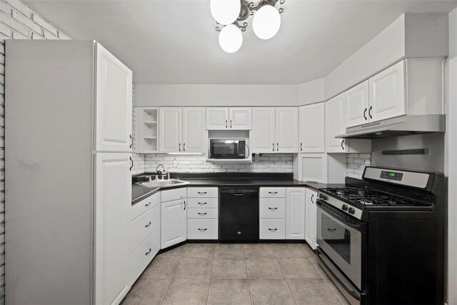 446 S Dallas Ave, Point Breeze, PA 15208 - kitchen with stainless steel gas stove, black dishwasher, under cabinet range hood, dark countertops, and backsplash