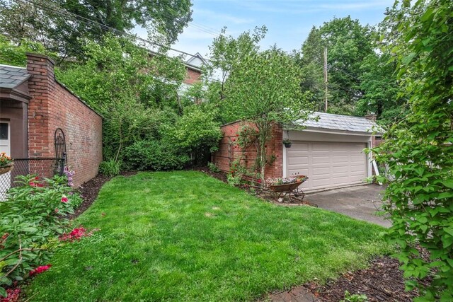 446 S Dallas Ave, Point Breeze, PA 15208 - view of grassy yard with a detached garage