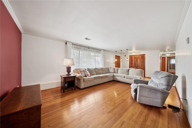 954 Illinois Ave, Braddock Hills, PA 15221 - living room with crown molding, light wood-style flooring, ceiling fan, and baseboards