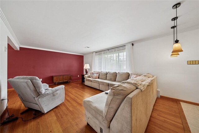 954 Illinois Ave, Braddock Hills, PA 15221 - living room with ornamental molding, baseboards, and light wood finished floors