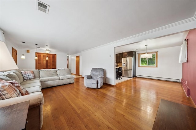 954 Illinois Ave, Braddock Hills, PA 15221 - living area with a baseboard radiator, light wood-type flooring, and crown molding