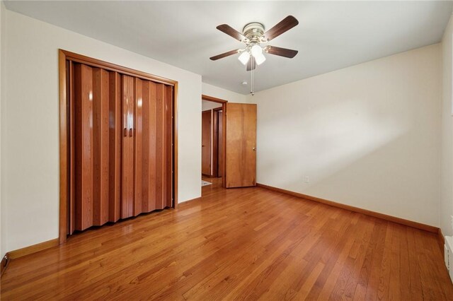 954 Illinois Ave, Braddock Hills, PA 15221 - unfurnished bedroom featuring baseboards, light wood finished floors, ceiling fan, and a closet