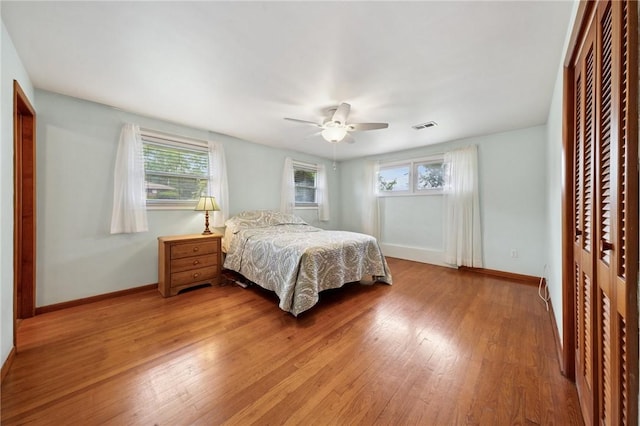 954 Illinois Ave, Braddock Hills, PA 15221 - bedroom featuring multiple windows, light wood-style flooring, and baseboards