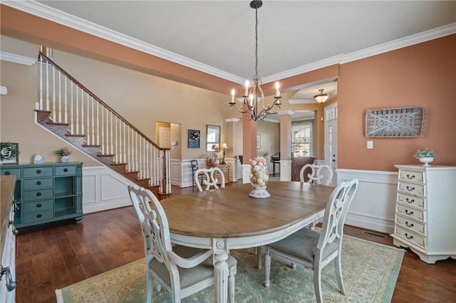 361 Patriot Ln, Economy, PA 15042 - dining space featuring ornamental molding, dark wood-type flooring, stairway, wainscoting, and ornate columns