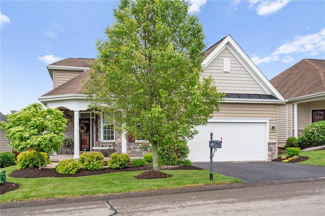 361 Patriot Ln, Economy, PA 15042 - view of property hidden behind natural elements featuring stone siding, driveway, a standing seam roof, an attached garage, and metal roof