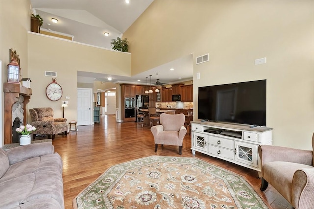 361 Patriot Ln, Economy, PA 15042 - living area featuring wood finished floors and high vaulted ceiling