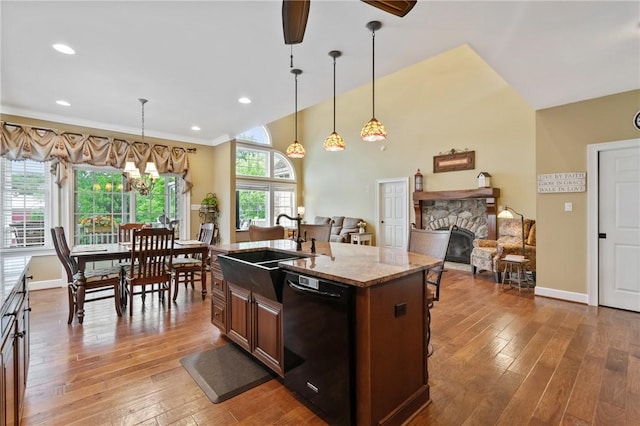 361 Patriot Ln, Economy, PA 15042 - kitchen with black dishwasher, a sink, a fireplace, hardwood / wood-style floors, and recessed lighting