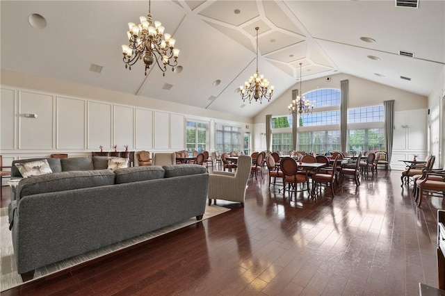 361 Patriot Ln, Economy, PA 15042 - living room with a chandelier, high vaulted ceiling, dark wood finished floors, and a decorative wall