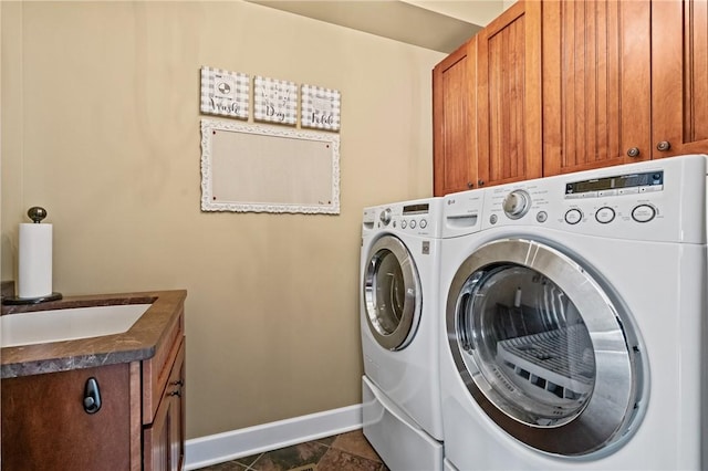 361 Patriot Ln, Economy, PA 15042 - laundry room featuring washing machine and clothes dryer, cabinet space, and baseboards