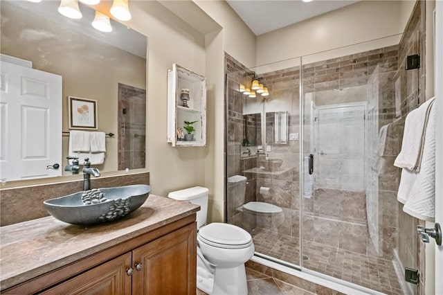 361 Patriot Ln, Economy, PA 15042 - bathroom with vanity, toilet, a shower stall, and tile patterned flooring