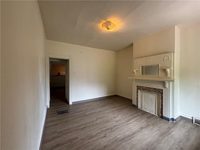 7707-7708-7710 Forest Way, Homewood-Brushton, PA 15208 - unfurnished living room featuring wood finished floors, baseboards, and a fireplace