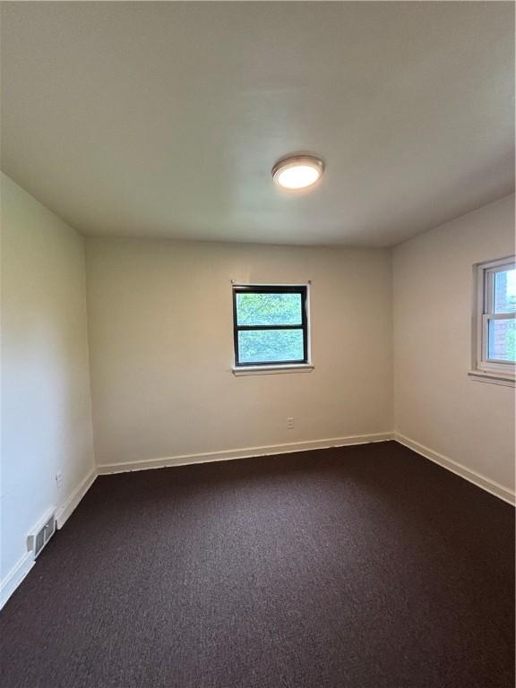 7707-7708-7710 Forest Way, Homewood-Brushton, PA 15208 - empty room with baseboards and dark carpet