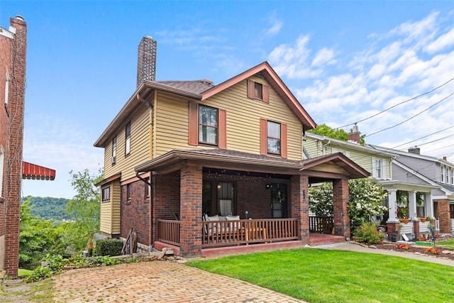 952 Jackman Ave, Avalon, PA 15202 - view of front of house with covered porch, a chimney, a front lawn, and brick siding