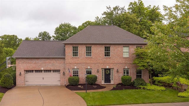 104 Southridge Dr, Cranberry Twp, PA 16066 - colonial inspired home with a front yard, a shingled roof, brick siding, and concrete driveway