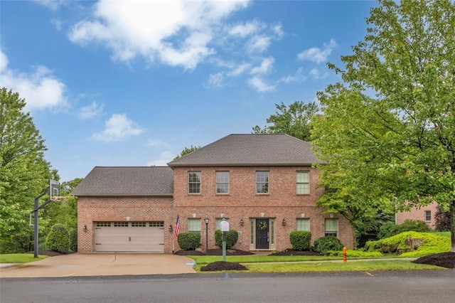 104 Southridge Dr, Cranberry Twp, PA 16066 - colonial house with driveway, brick siding, an attached garage, and roof with shingles