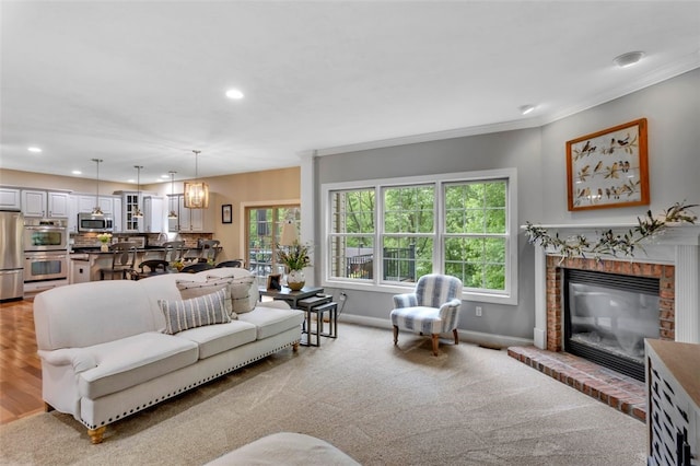 104 Southridge Dr, Cranberry Twp, PA 16066 - living room featuring a fireplace, baseboards, recessed lighting, ornamental molding, and carpet floors