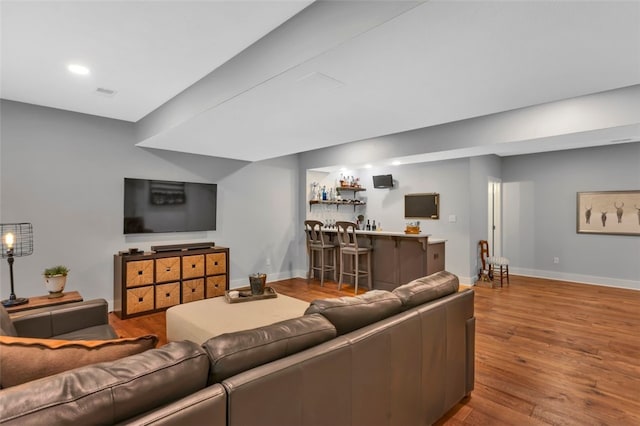104 Southridge Dr, Cranberry Twp, PA 16066 - living room featuring bar, wood finished floors, baseboards, and recessed lighting