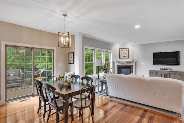 104 Southridge Dr, Cranberry Twp, PA 16066 - dining space featuring a chandelier, crown molding, a high end fireplace, light wood finished floors, and recessed lighting