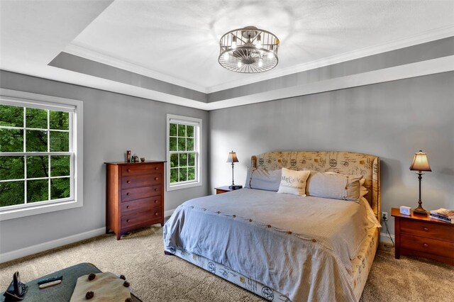 104 Southridge Dr, Cranberry Twp, PA 16066 - carpeted bedroom featuring multiple windows, baseboards, ornamental molding, a chandelier, and a tray ceiling