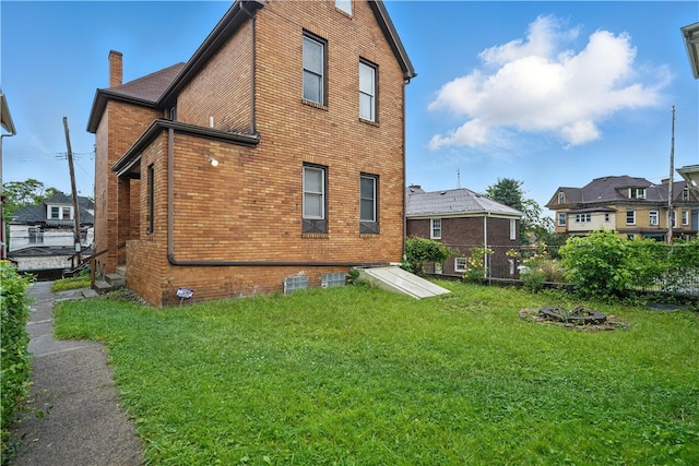 342 E 11th Ave, Homestead, PA 15120 - back of property with brick siding and a chimney
