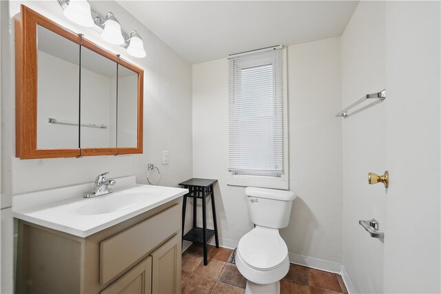 342 E 11th Ave, Homestead, PA 15120 - bathroom featuring toilet, vanity, and baseboards